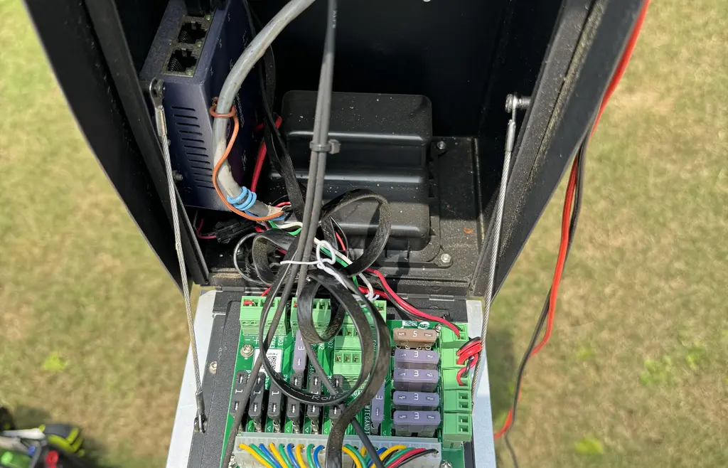 Area behind control board where wiring is tucked in place